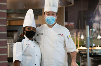 two chefs wearing masks