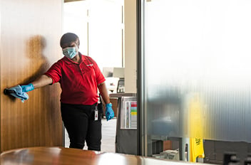 Person cleaning conference room